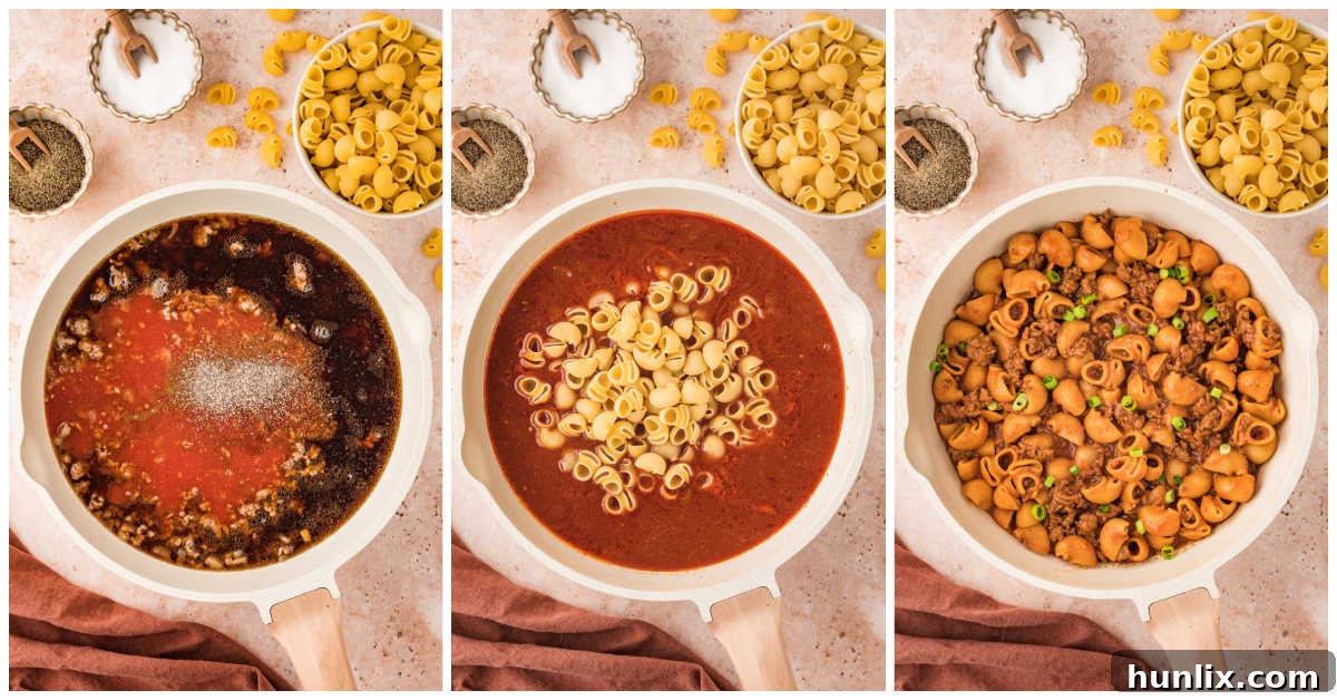 A close-up of goulash cooking in a skillet, with macaroni noodles added.
