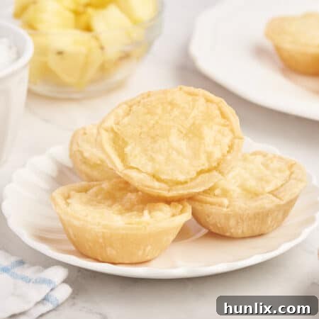 Pineapple tarts on a plate.
