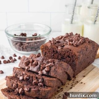 A loaf of chocolate zucchini bread cut into slices.