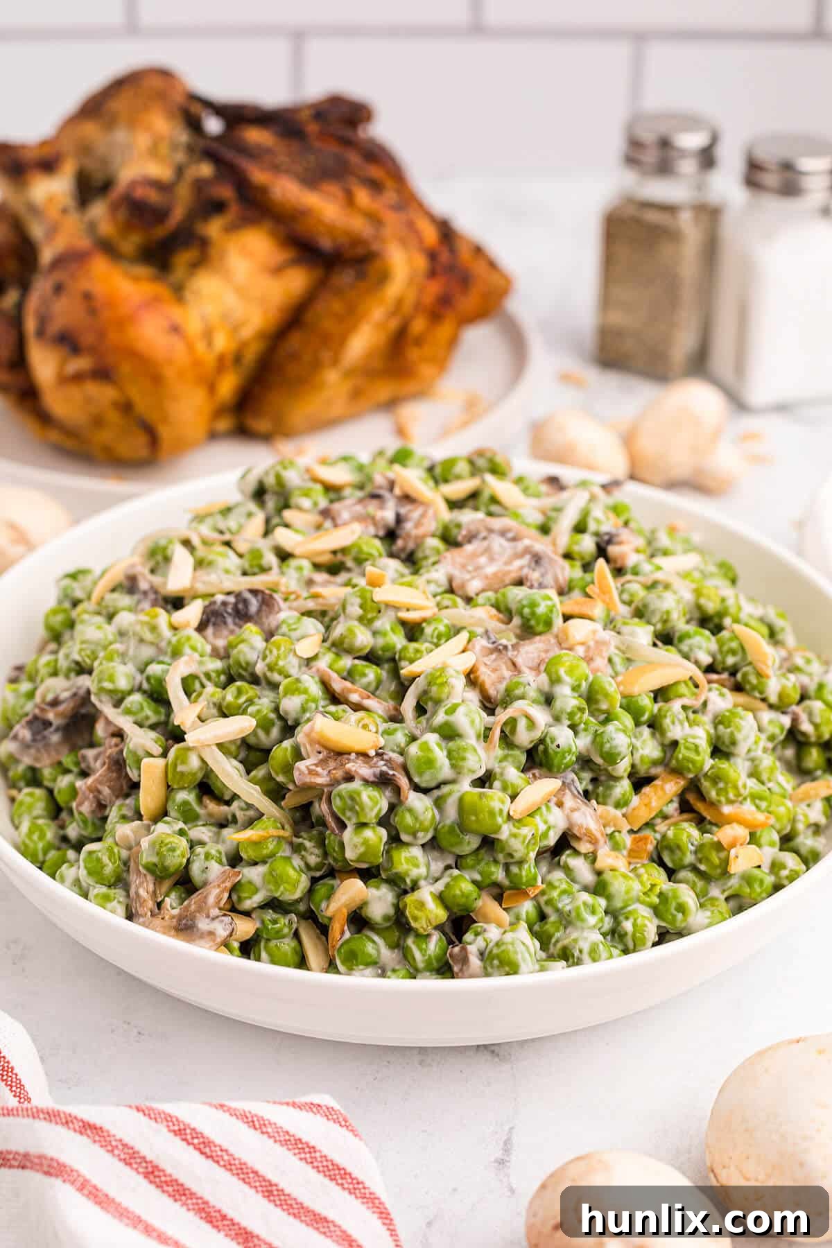 A beautifully presented bowl of Company Peas, highlighting its creamy texture and vibrant ingredients.