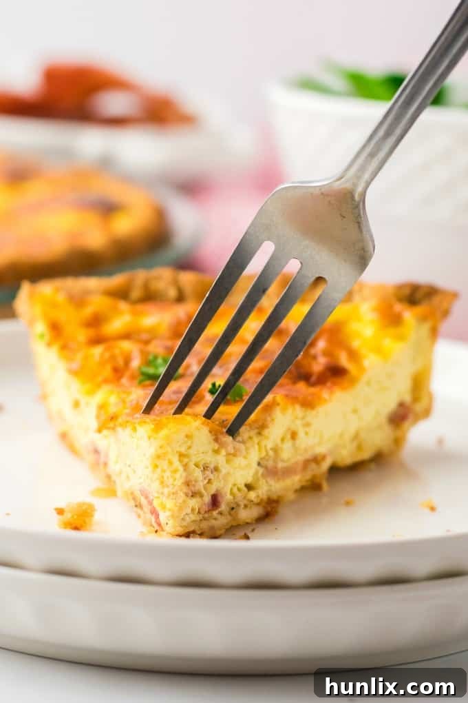 A large Quiche Lorraine on a cooling rack, freshly baked
