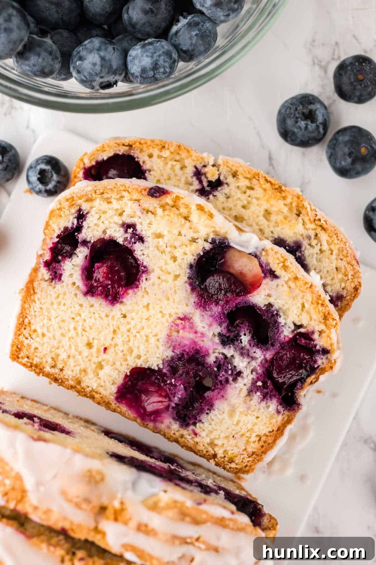 Blueberry Burst Loaf 7 Slices of bread on a white platter.
