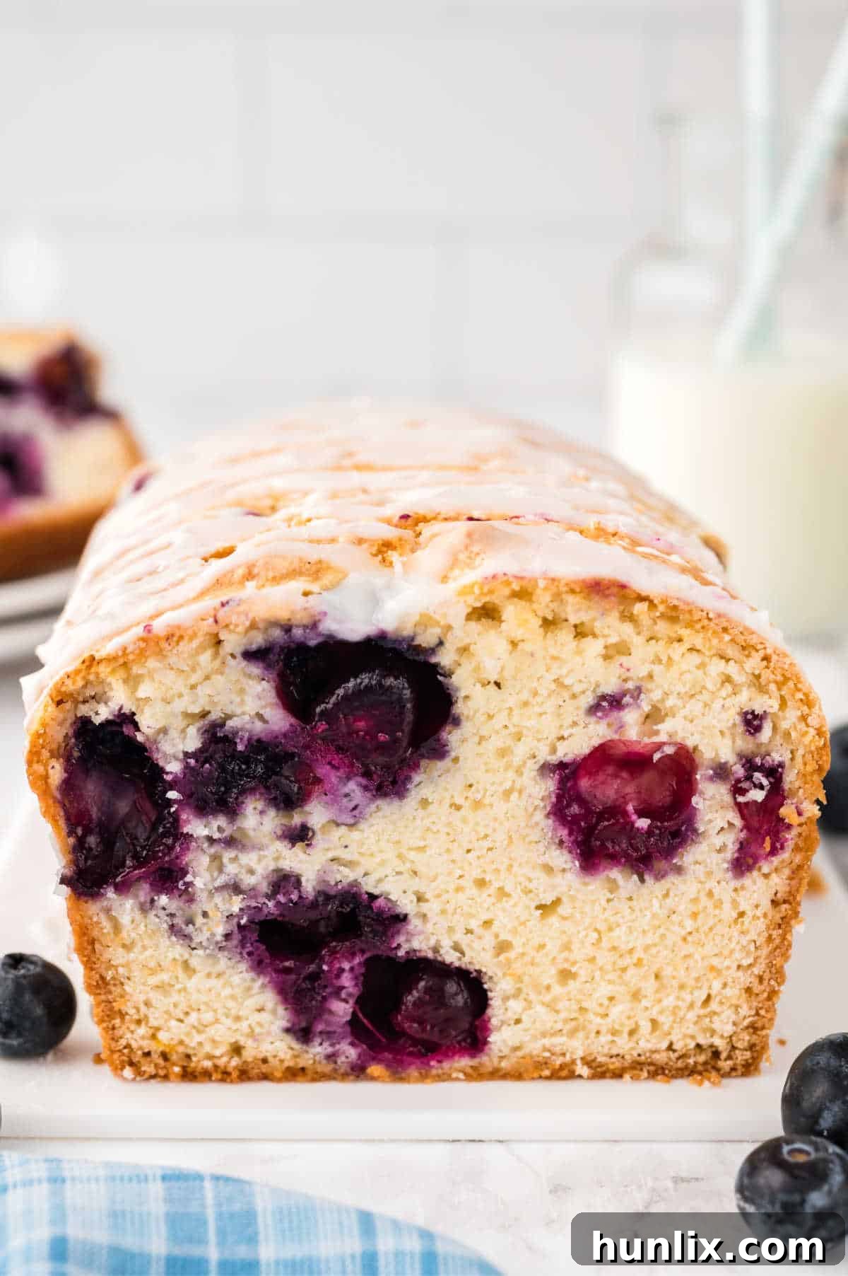 Blueberry Burst Loaf 9 Bread with a slice cut off the end.