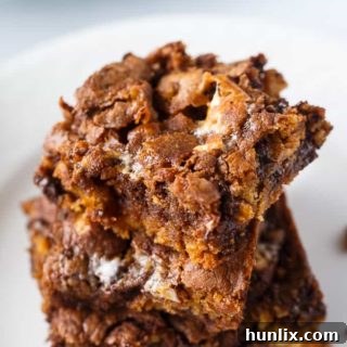 Molten Marshmallow Brownie Bliss 7 A stack of the recipe on a plate.