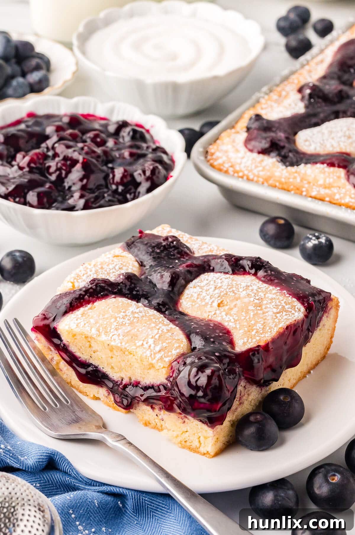 A piece of cake on a plate with a fork.
