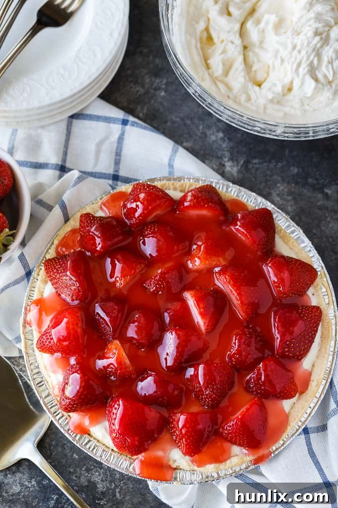 Strawberry Satin Pie - A beloved vintage summer pie that is worth the extra effort. Layers of toasted almonds, creamy and sweet vanilla filling and luscious strawberries enveloped in a shiny glaze make this dessert a huge hit.