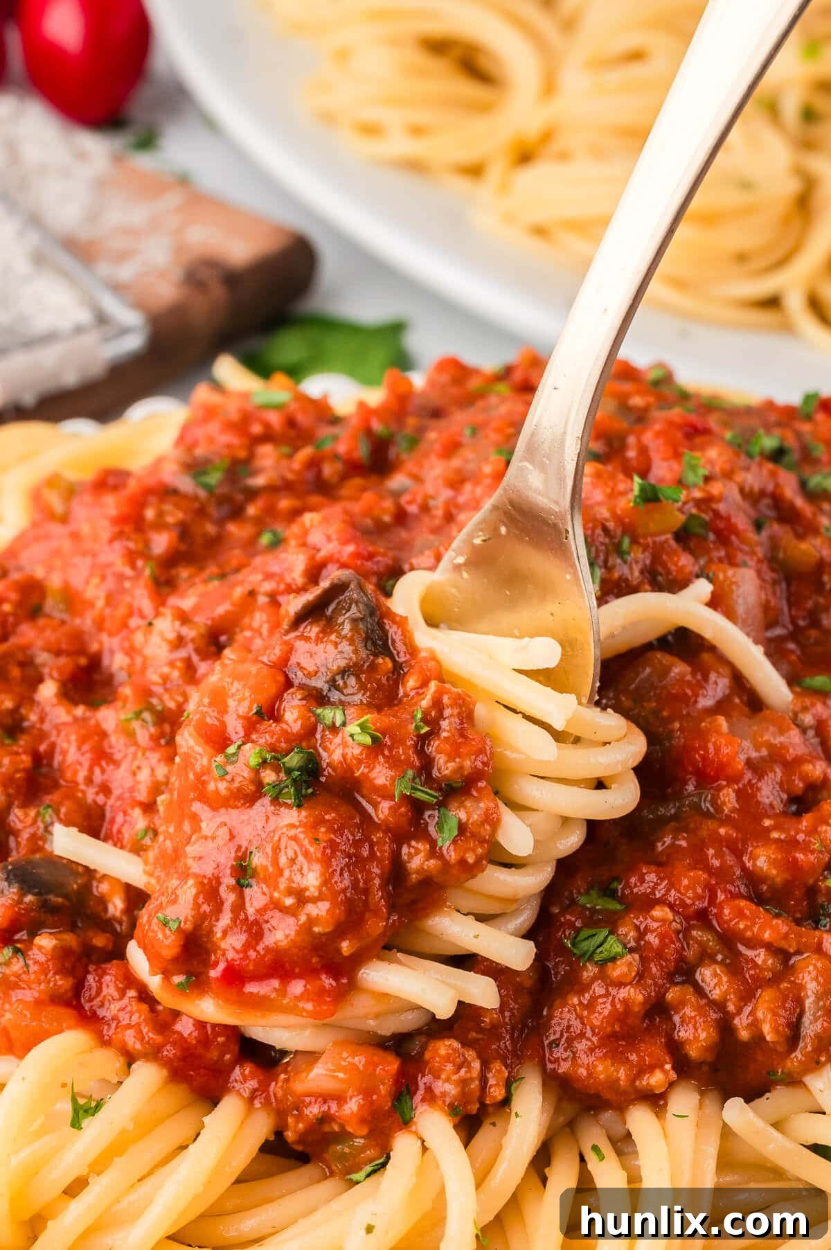 Mama's Perfect Pasta Sauce 8 Homemade spaghetti sauce on a fork, ready to be enjoyed.
