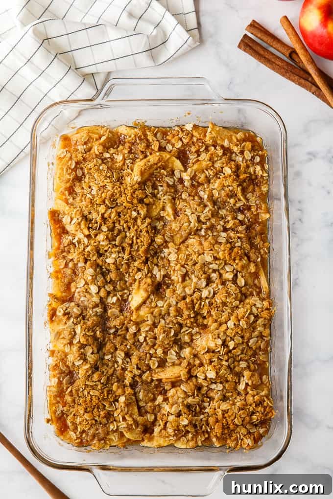 Apple Crisp - This simple old-fashioned dessert is baked with sweet and tart apples and topped with a brown sugar oat crumble. One of the best homemade fall desserts. Serve with vanilla ice cream for extra decadence.