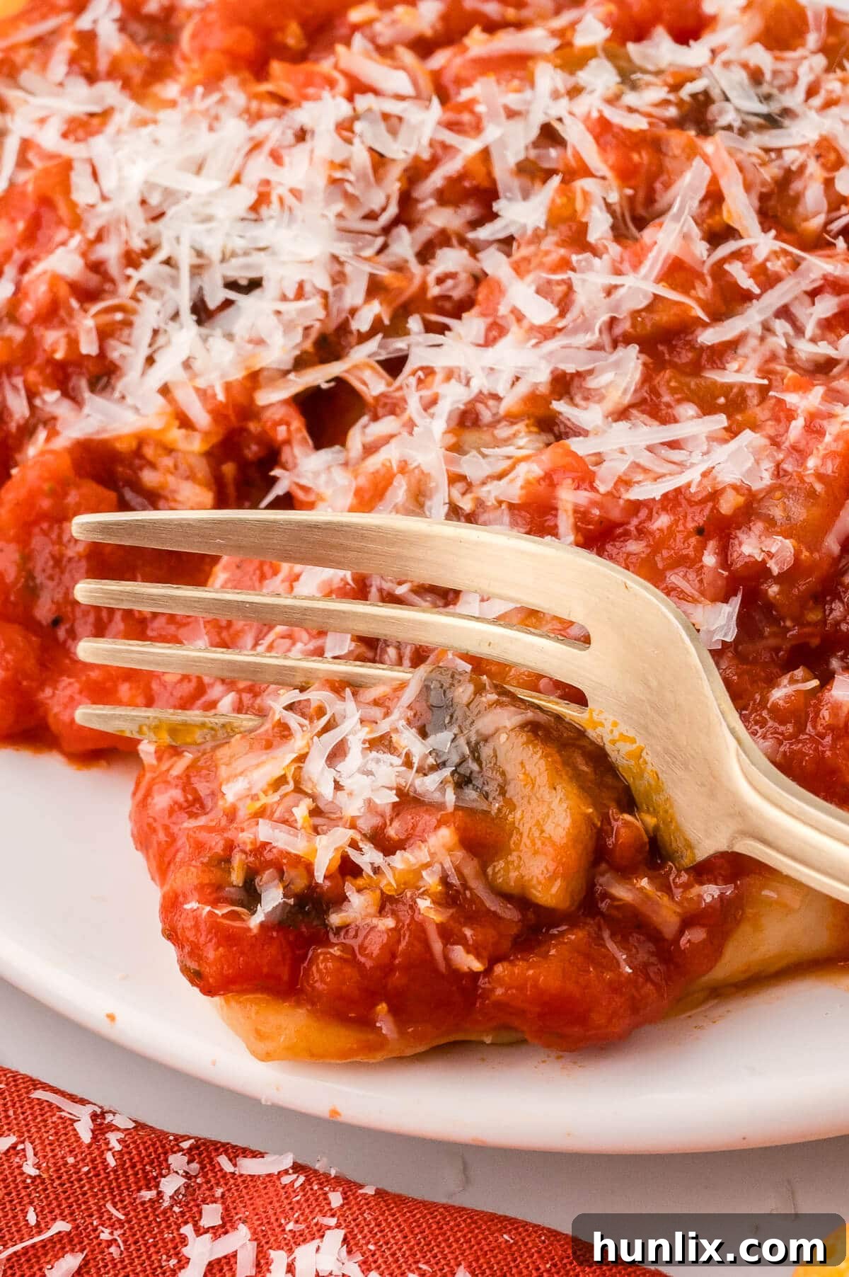 Hearty Homestyle Pierogi Casserole 9 A full plate of Pierogi casserole with a fork, ready to be eaten.