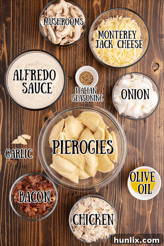 Creamy Chicken Pierogi Bake 3 A vibrant flat lay of all the fresh ingredients needed for Chicken Alfredo Pierogi Casserole, including pierogies, chicken, bacon, vegetables, and cheese.