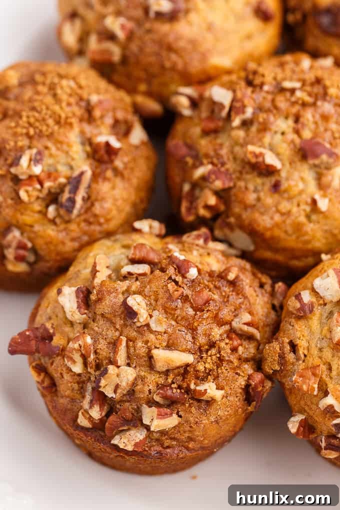 A cluster of freshly baked Banana Streusel Muffins, invitingly arranged.