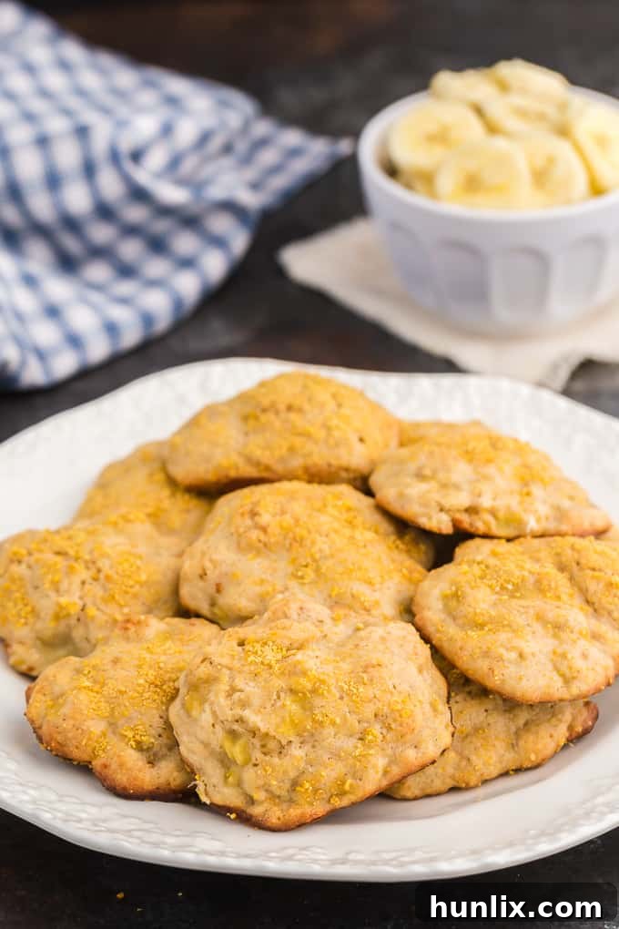 Delicious soft banana cookies resembling banana bread, freshly baked and arranged on a cooling rack, ready to be enjoyed.