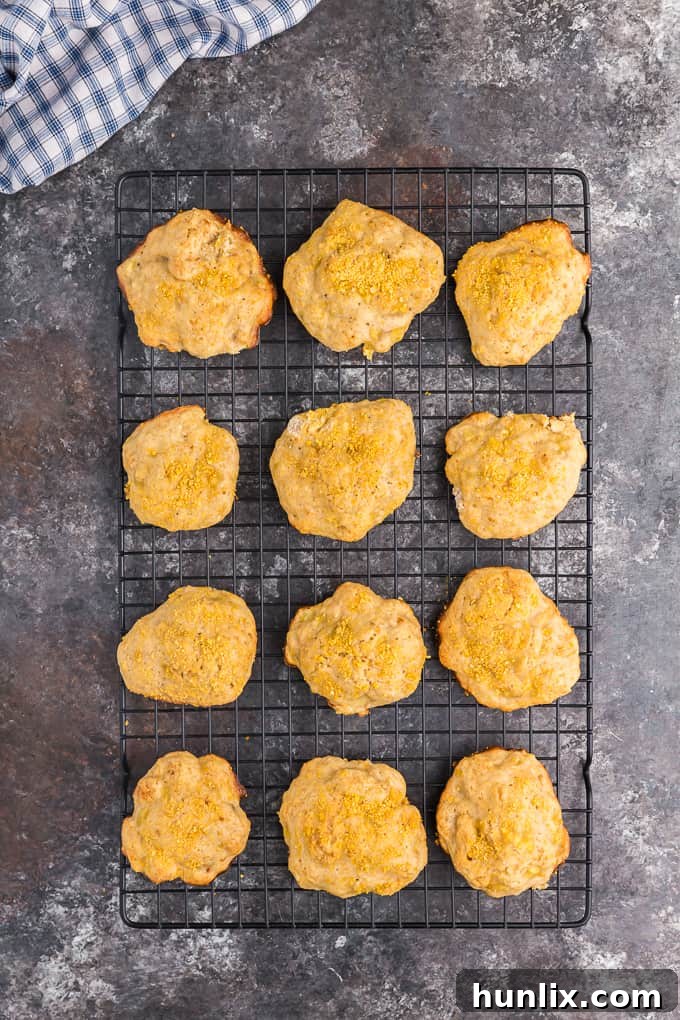 A fresh batch of soft, cake-like banana cookies, perfectly golden and cooling on a wire rack.