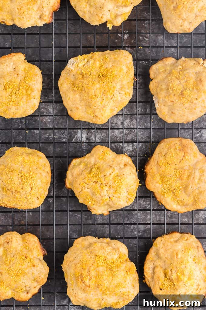 A close-up shot of a soft, perfectly baked banana cookie, showcasing its tender texture and inviting golden-brown crust.