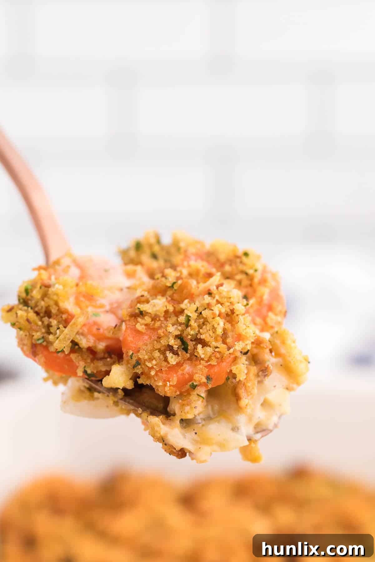 Sweet Carrot Bake 7 Another enticing view of the baked Carrot Casserole, highlighting its rich textures and the comforting warmth it brings to any meal.