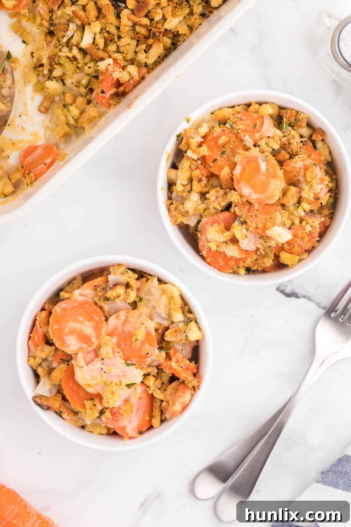 Sweet Carrot Bake 8 A vibrant and appealing serving of Carrot Casserole on a plate, ready to be enjoyed as a delightful side dish.