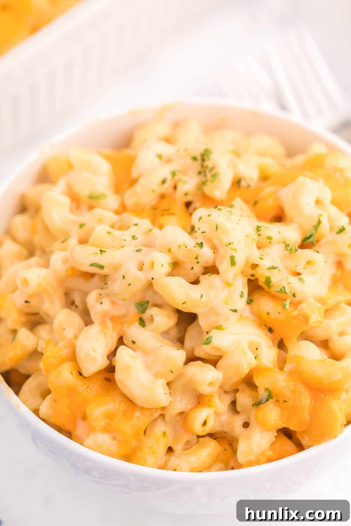 Golden-Crusted Mac and Cheese 11 Baked Macaroni and Cheese - This old-fashioned classic recipe is a family favorite dinner and so easy to make. Tender elbow macaroni noodles are enveloped in an ultra creamy homemade cheese sauce and covered with melted cheddar cheese.