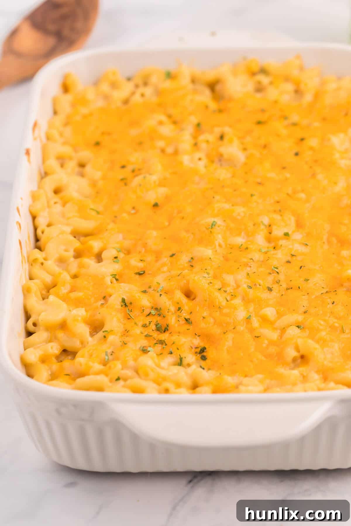 Golden-Crusted Mac and Cheese 6 Baked Macaroni and Cheese - This old-fashioned classic recipe is a family favorite dinner and so easy to make. Tender elbow macaroni noodles are enveloped in an ultra creamy homemade cheese sauce and covered with melted cheddar cheese.