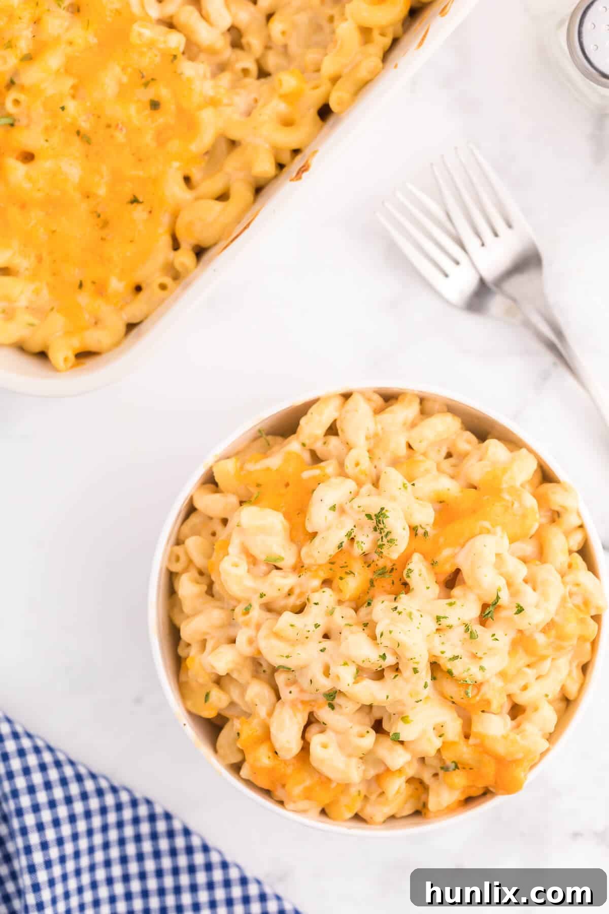 Golden-Crusted Mac and Cheese 9 Baked Macaroni and Cheese - This old-fashioned classic recipe is a family favorite dinner and so easy to make. Tender elbow macaroni noodles are enveloped in an ultra creamy homemade cheese sauce and covered with melted cheddar cheese.