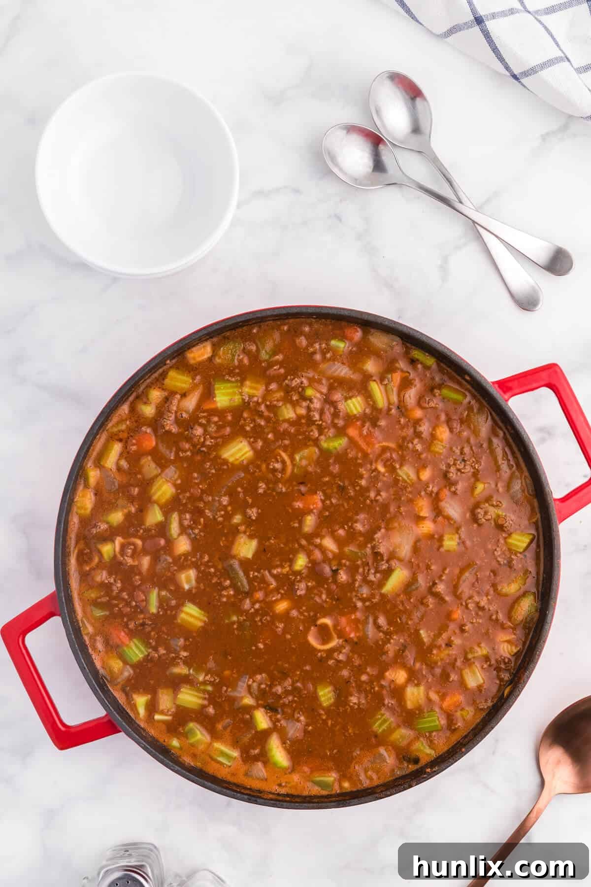 Hodge Podge Soup - A hearty soup recipe like grandma used to make. It's a clean out your kitchen kind of meal with two cans of soup, pork and beans, ground beef and celery. Perfect for busy days!