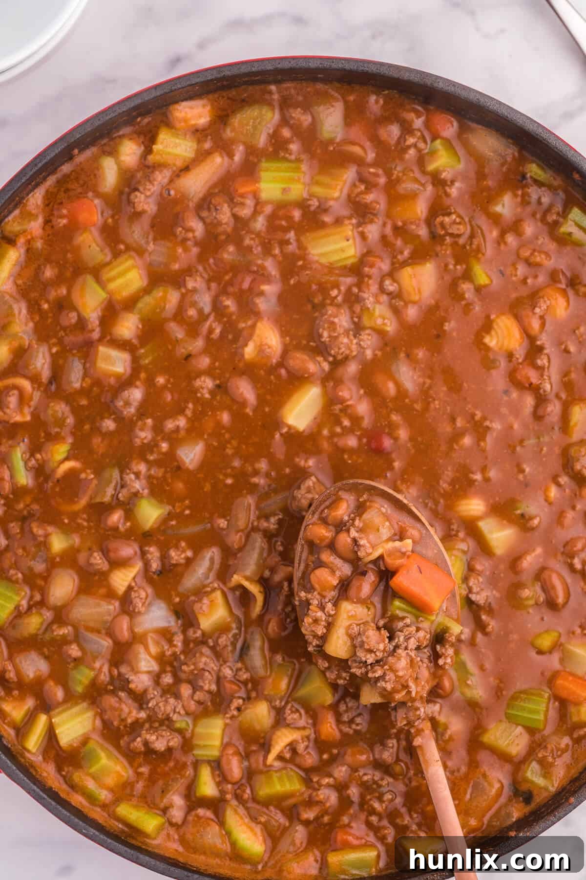Hodge Podge Soup - A hearty soup recipe like grandma used to make. It's a clean out your kitchen kind of meal with two cans of soup, pork and beans, ground beef and celery. Perfect for busy days!
