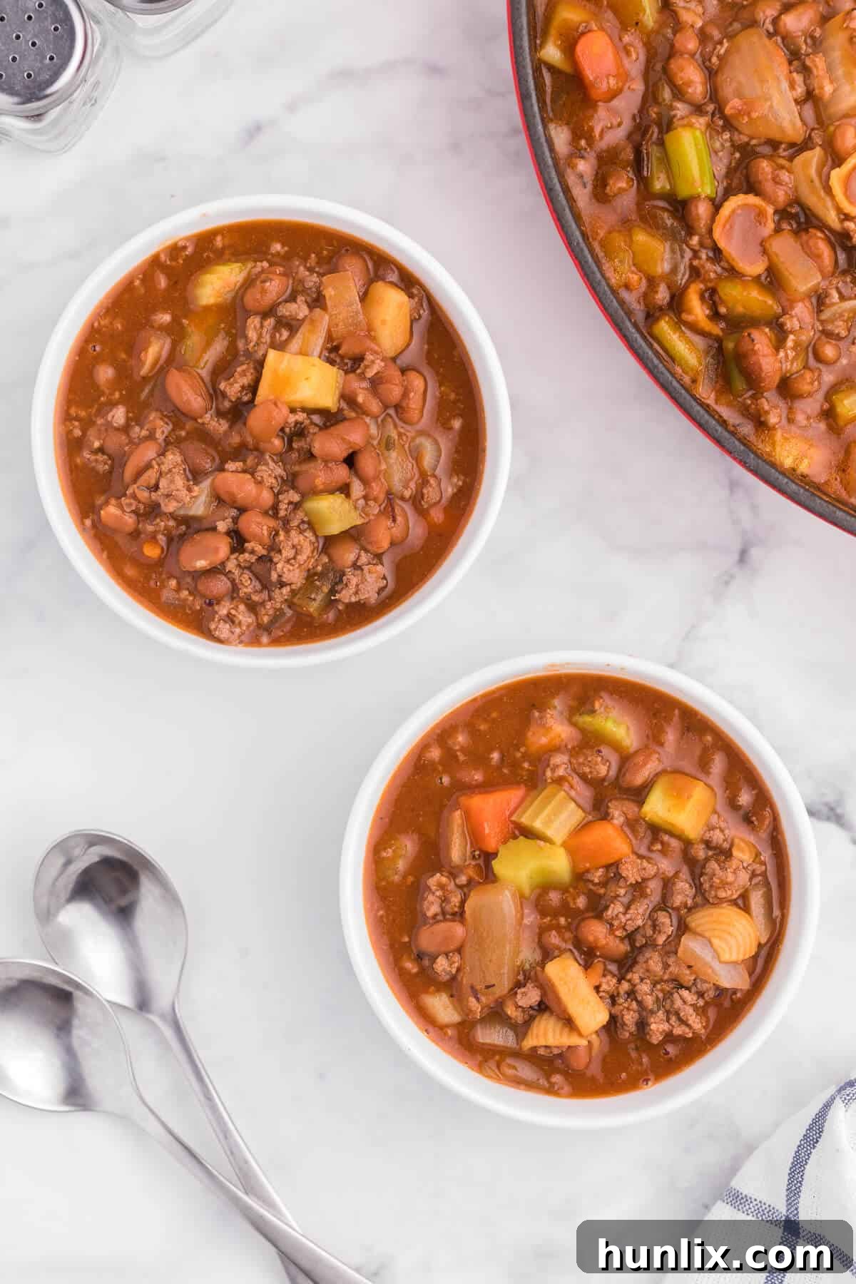 Hodge Podge Soup - A hearty soup recipe like grandma used to make. It's a clean out your kitchen kind of meal with two cans of soup, pork and beans, ground beef and celery. Perfect for busy days!