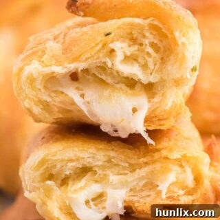 A stack of Air Fryer Garlic Cheese Stuffed Crescent Rolls.
