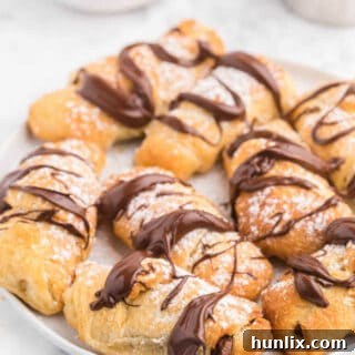 Perfect Air Fryer Chocolate Croissants 12 The finished Air Fryer Chocolate Croissants on a plate, garnished and ready to serve.