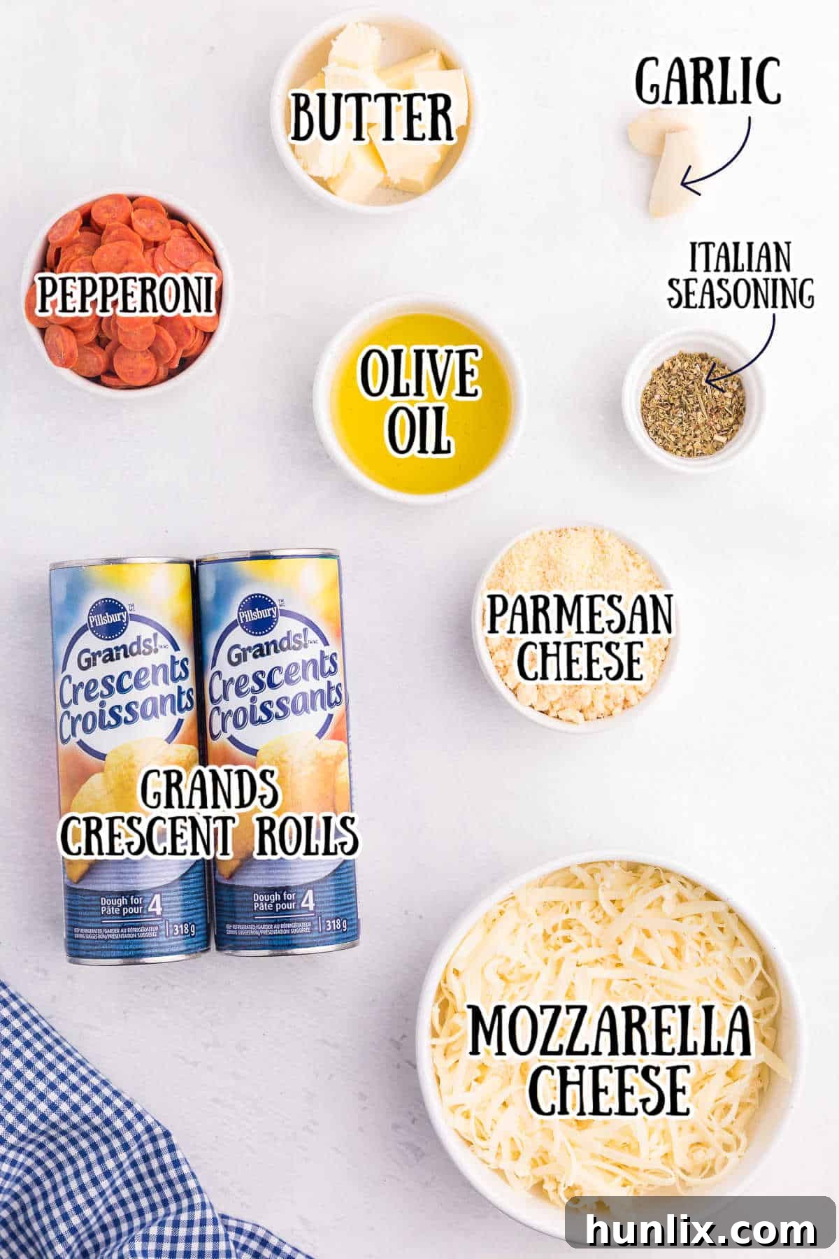 Ingredients for Pizza Monkey Bread Recipe laid out on a table