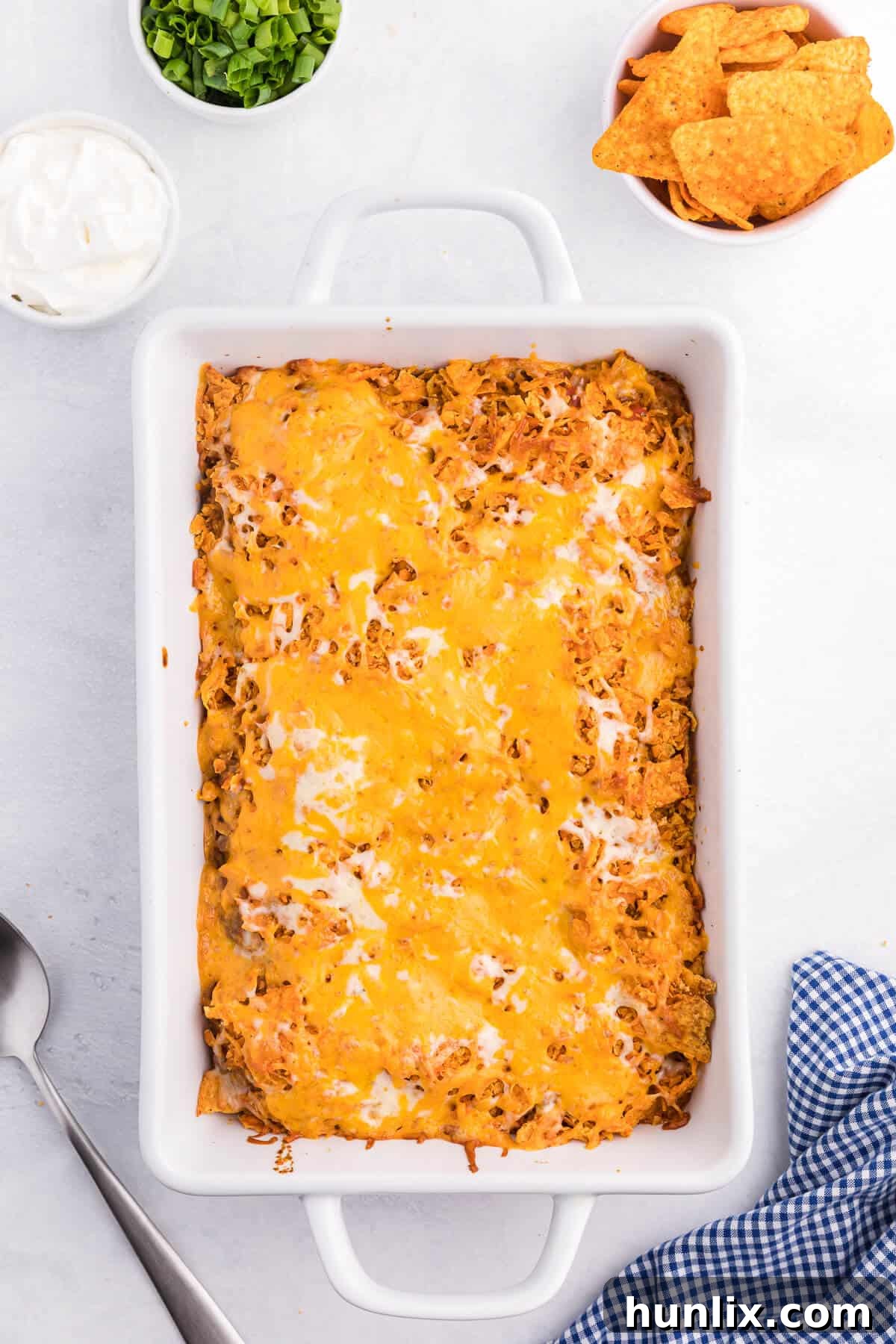 Loaded Doritos Casserole 8 Doritos Casserole Recipe - Take Mexican night to a whole new level with this easy taco bake recipe. Made with ground beef, sour cream, spices and loads of cheese, it's zesty with hearty Tex Mex flavor. A yummy dinner recipe your family will love!