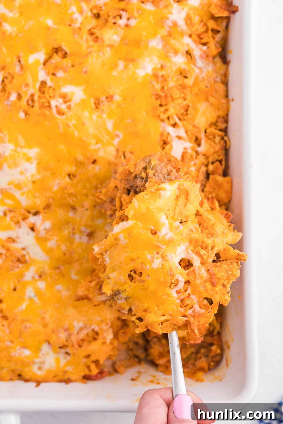 Loaded Doritos Casserole 10 Doritos Casserole Recipe - Take Mexican night to a whole new level with this easy taco bake recipe. Made with ground beef, sour cream, spices and loads of cheese, it's zesty with hearty Tex Mex flavor. A yummy dinner recipe your family will love!