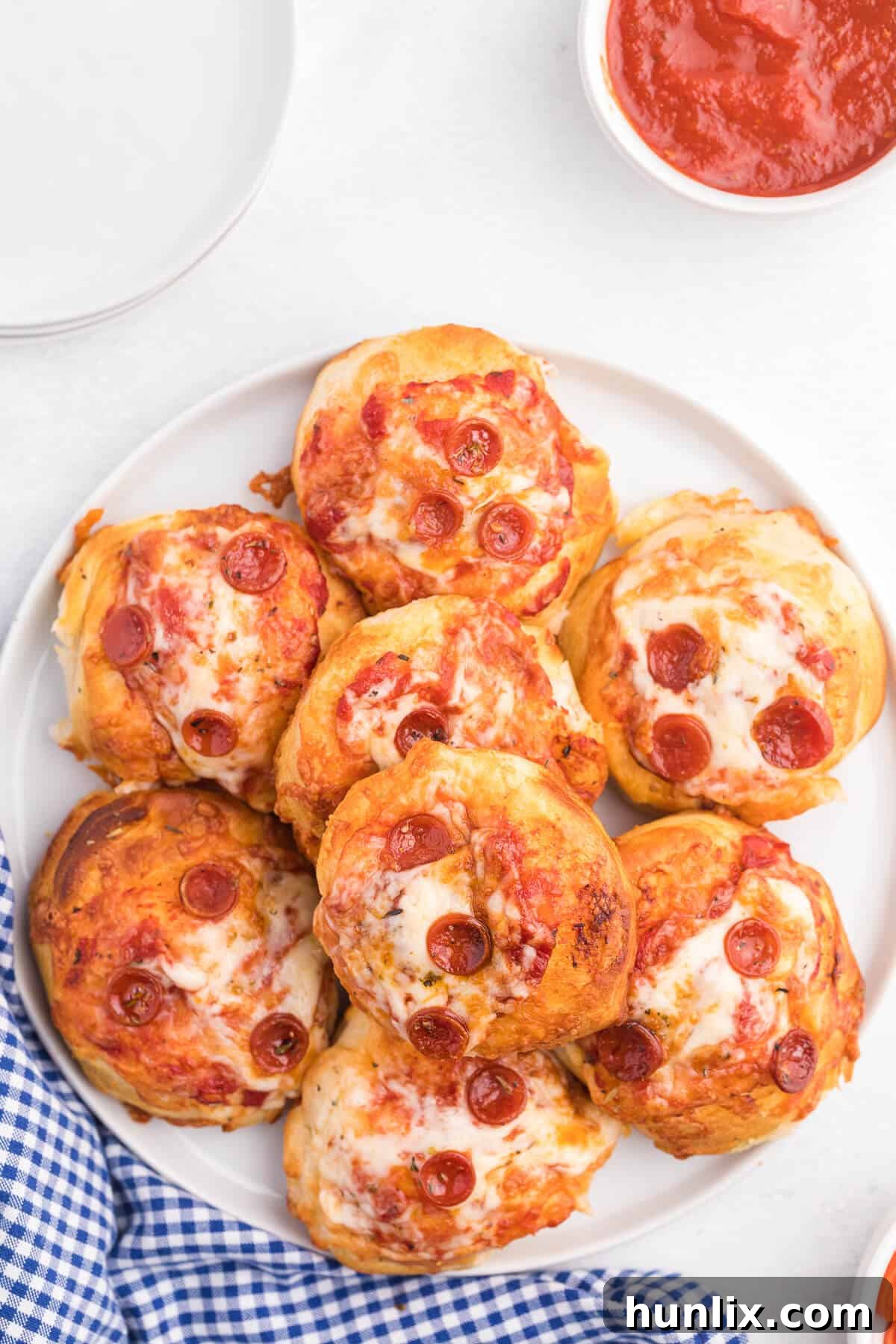 Irresistible Air Fryer Pizza Buns 6 The finished air fryer pizza buns served on a plate.