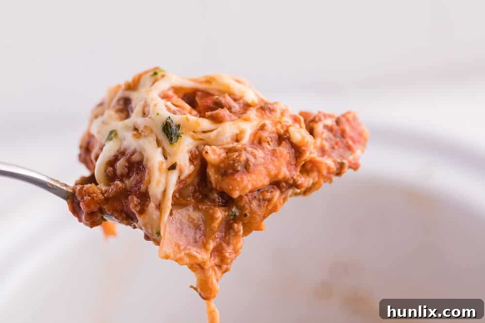 Easy One-Pot Slow Cooker Ravioli Lasagna 11 Slow Cooker Ravioli Lasagna - This Lazy Lasagna is a super easy Crockpot recipe made with frozen ravioli, homemade tomato sauce with beef and loads of cheese. You'll love all the cheesy, hearty layers. Plus, it's freezer friendly!