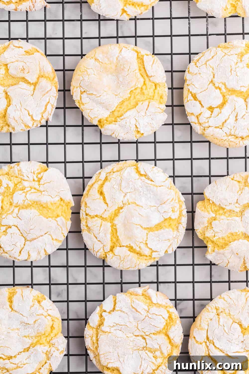 Delightful Cool Whip Cookies showcasing their soft, crinkly texture, perfect for a quick and easy dessert. These vibrant cookies are made with cake mix and are incredibly versatile in flavor.