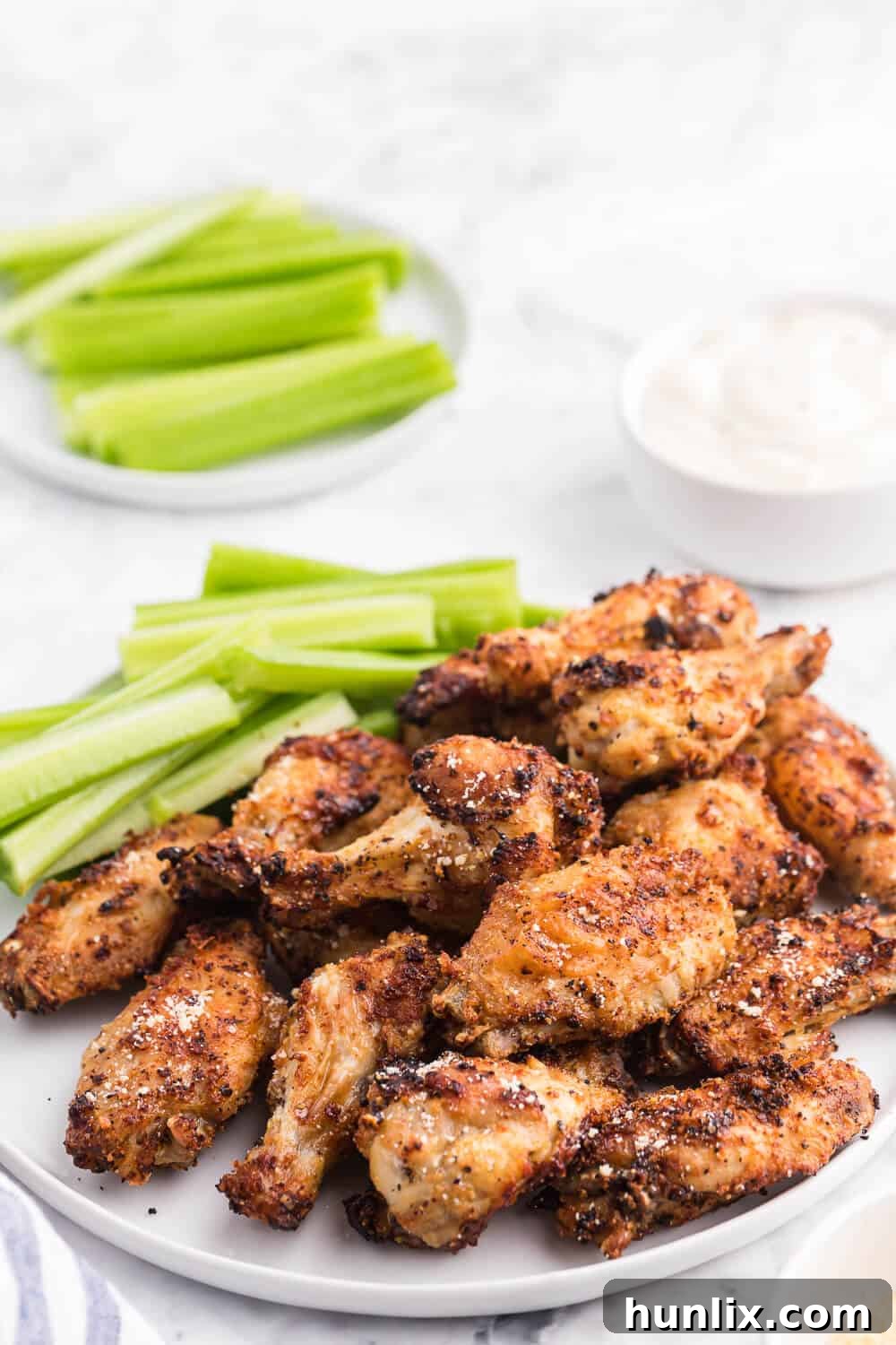 The recipe on a plate with celery sticks.