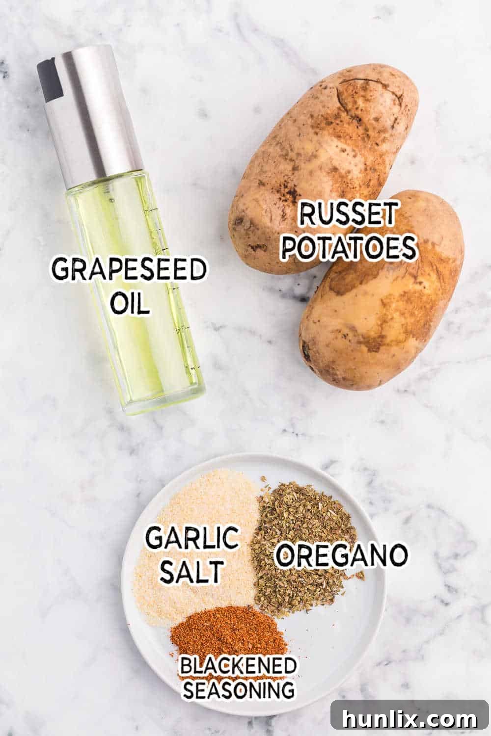 Ingredients for air fryer potato chips laid out on a marble counter.