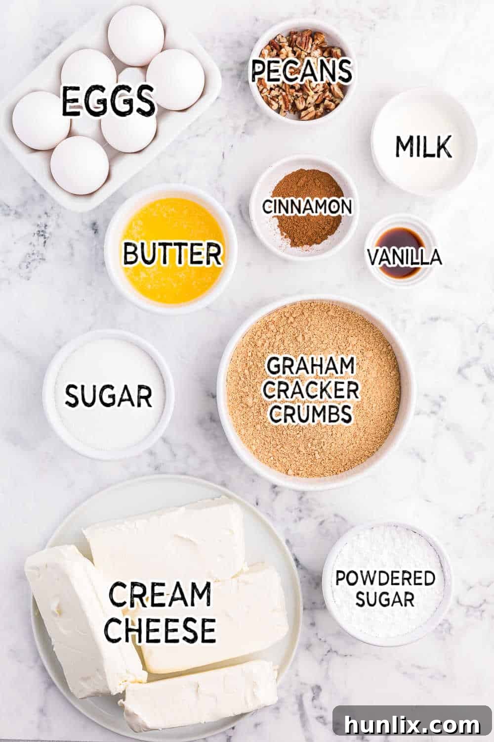 A vibrant selection of ingredients laid out, ready for baking this delicious cinnamon roll cheesecake.