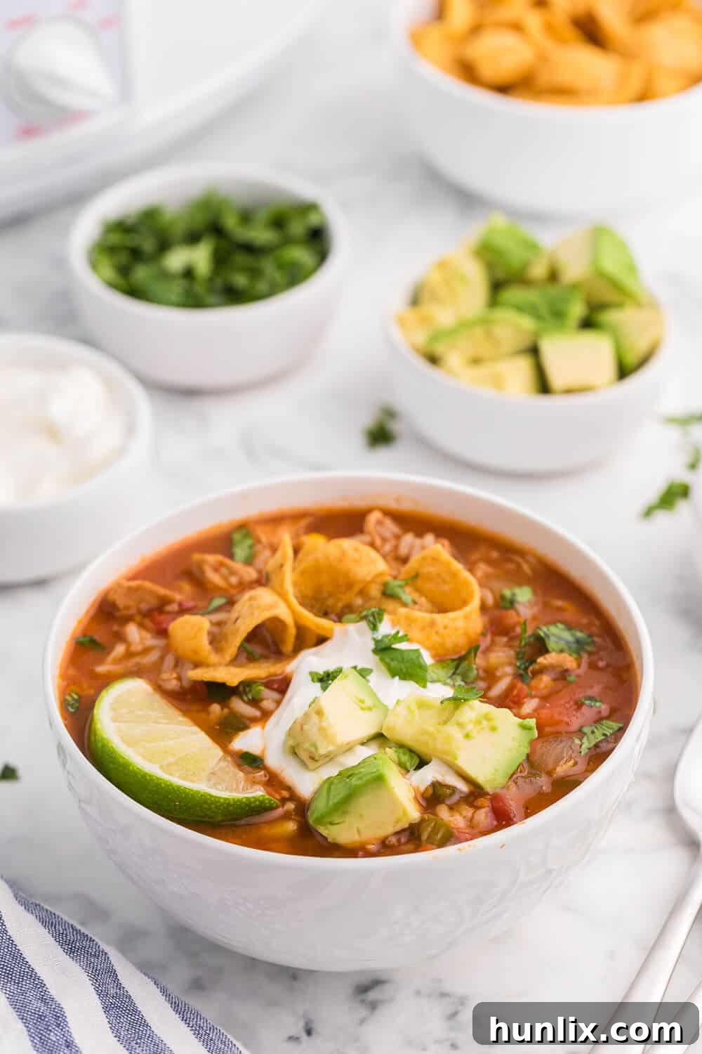 A white bowl filled with southwest chicken and rice soup