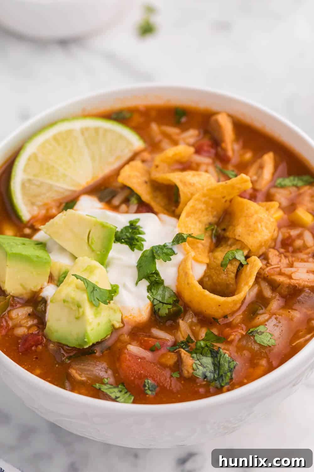 A white bowl filled with southwest chicken and rice soup