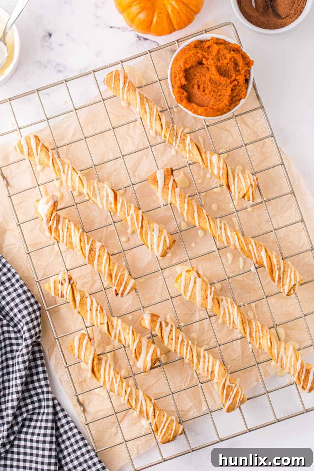 Air fryer pumpkin pie twists beautifully arranged on a cooling rack, ready to be devoured.