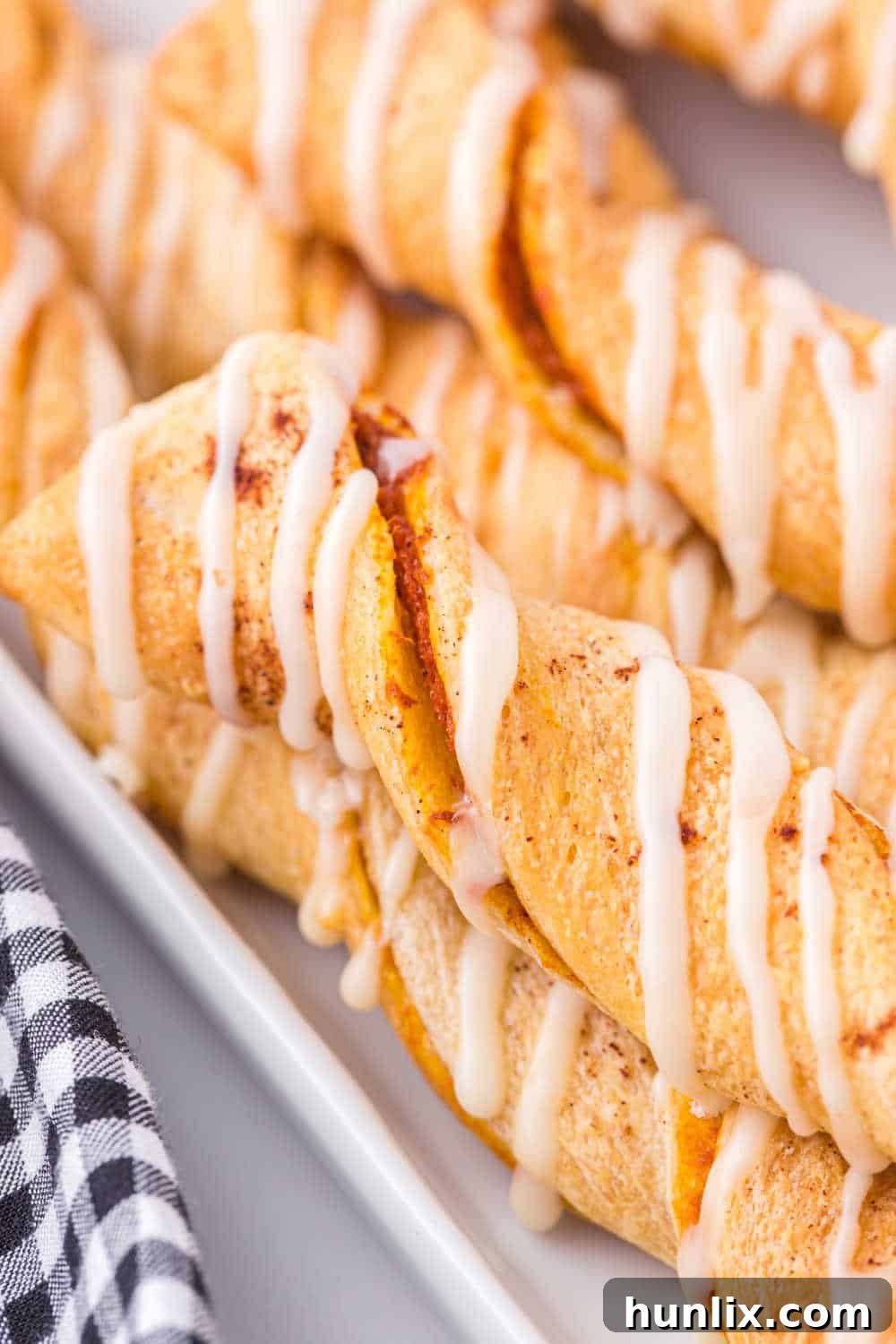 Another enticing view of the Air Fryer Pumpkin Pie Twists artfully arranged on a white platter, ready to be enjoyed as a delightful dessert or snack.