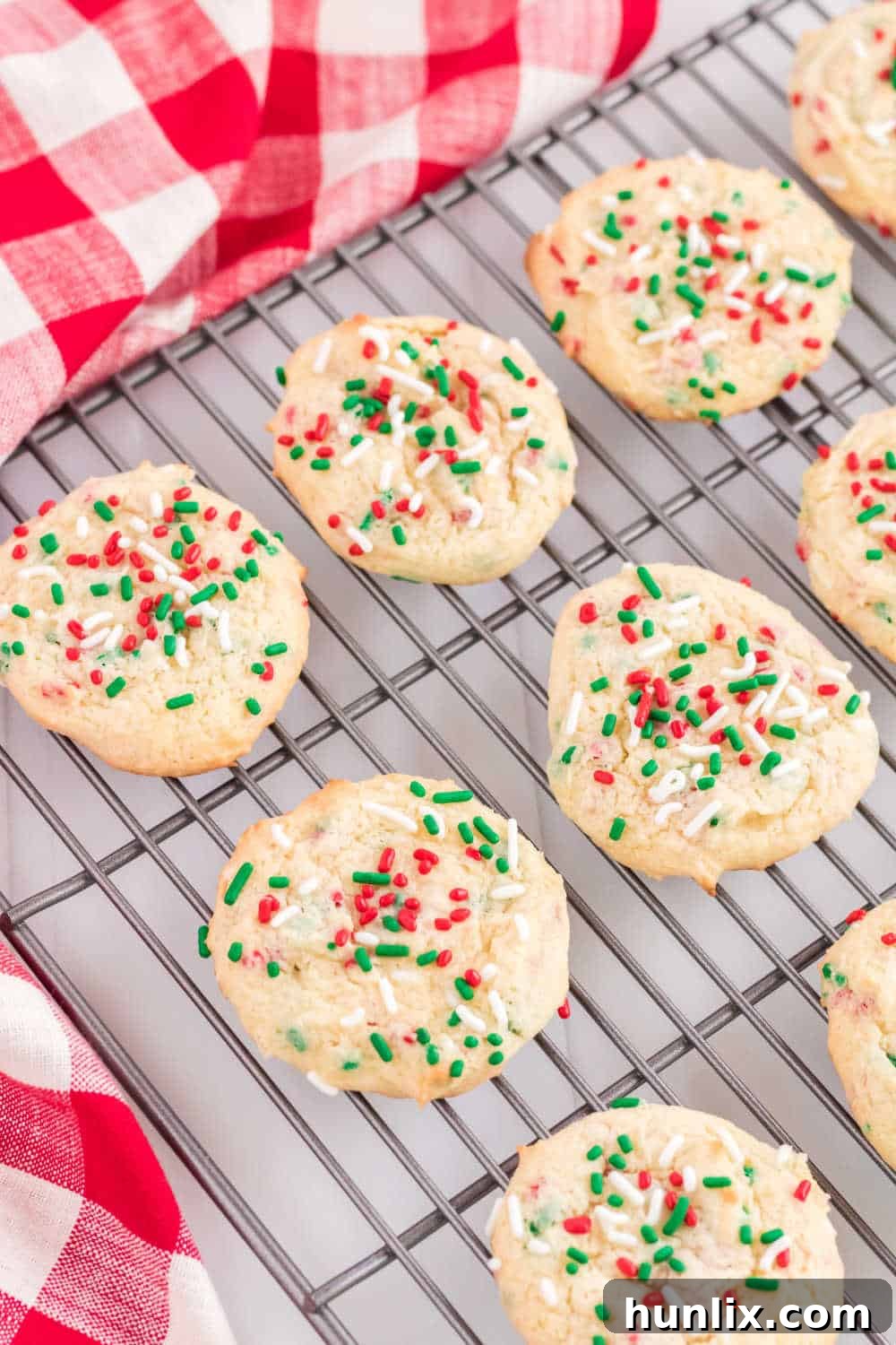 Easy Festive Cake Mix Cookies 2 christmas cake mix cookies on a cooling rack
