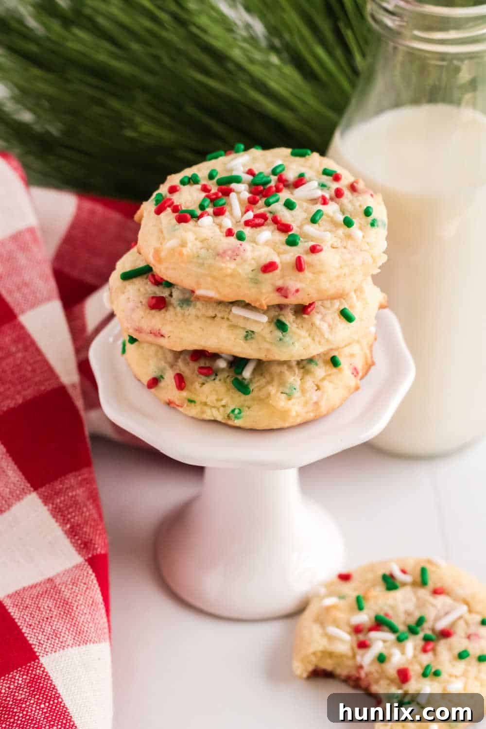Easy Festive Cake Mix Cookies 7 a stack of christmas cake mix cookies on a cupcake stand