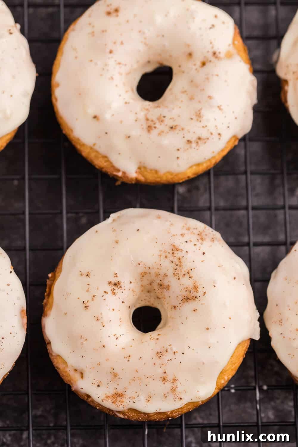 eggnog donuts on a cooling rack