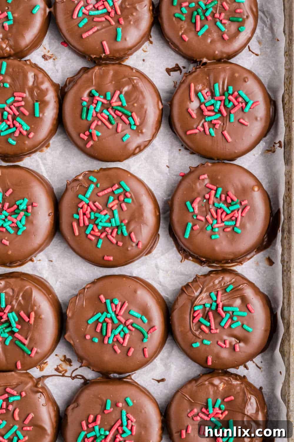 Ritz Cracker Delights 8 A batch of Ritz cracker cookies resting on a parchment-lined baking sheet, waiting to set.