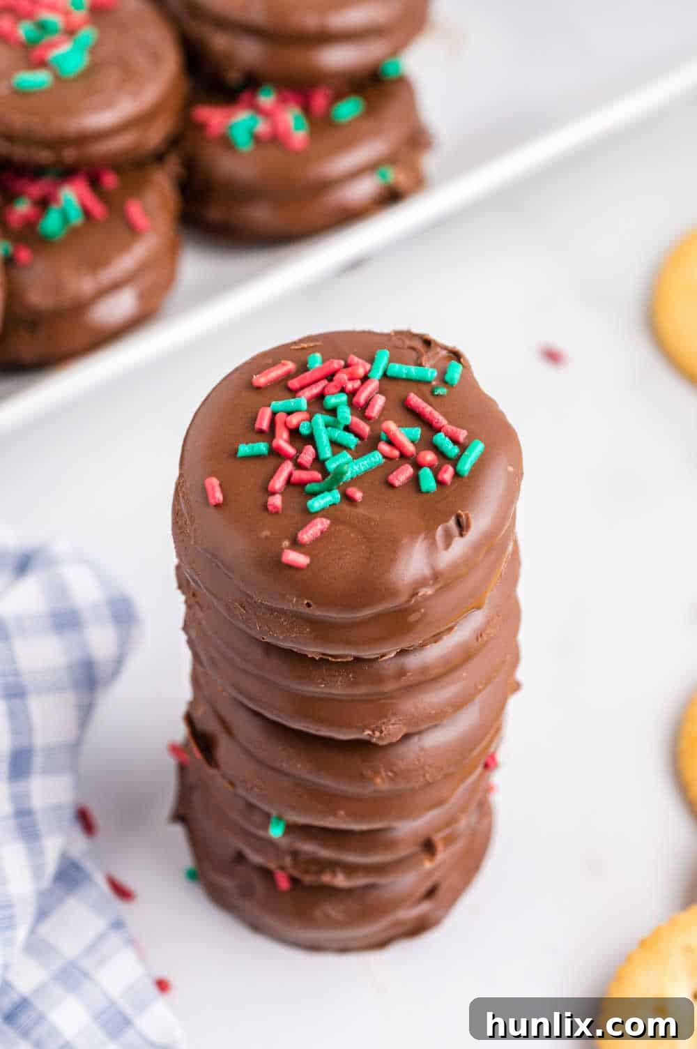 Ritz Cracker Delights 9 A neatly stacked pile of Ritz Cracker cookies, showcasing their chocolate coating.