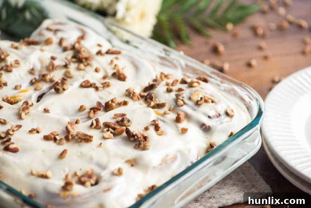Pumpkin Spice Cinnamon Swirls 2 Freshly baked pumpkin cinnamon rolls in a casserole pan, ready to be served
