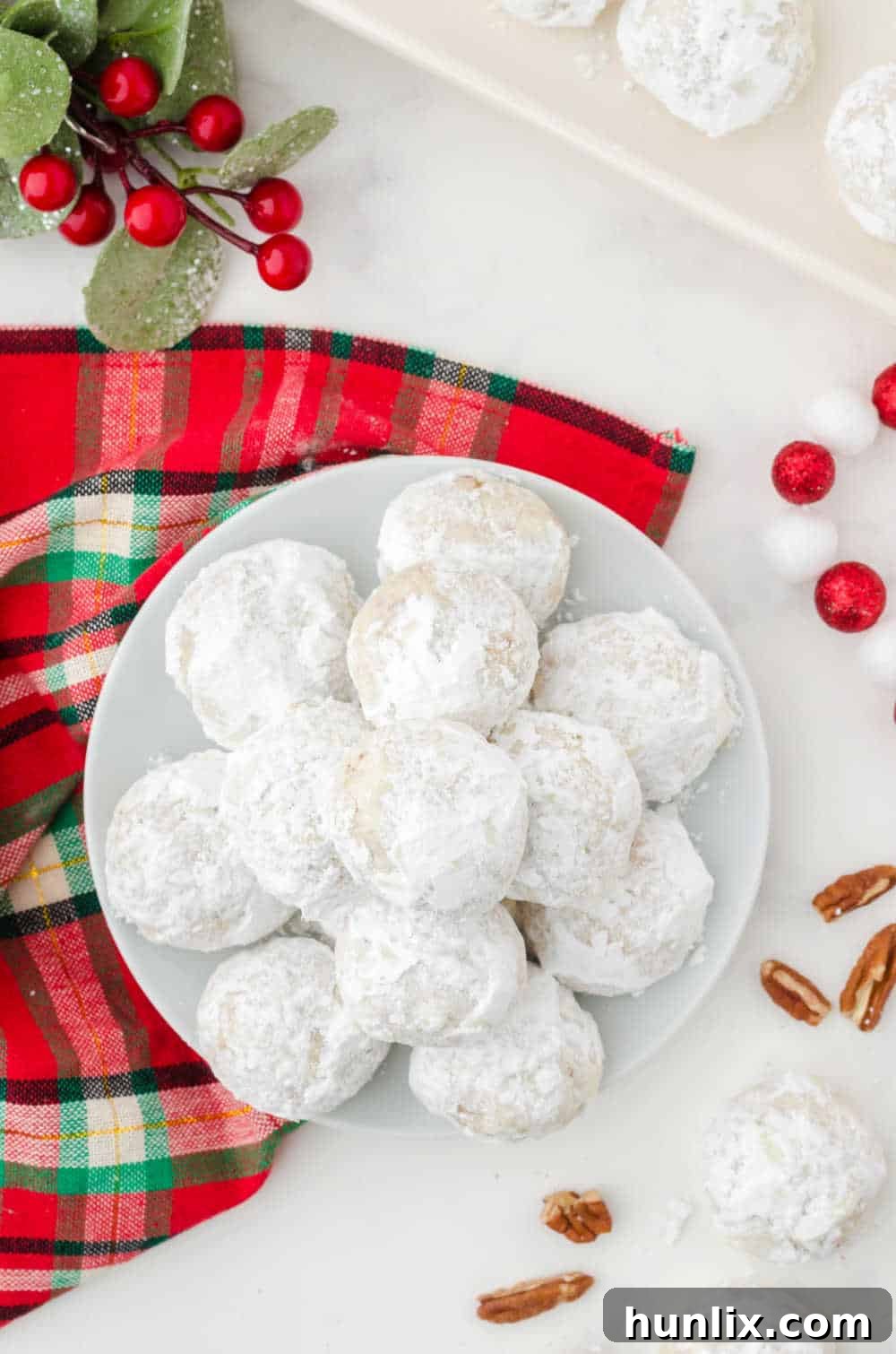 snowball cookies on a white plate
