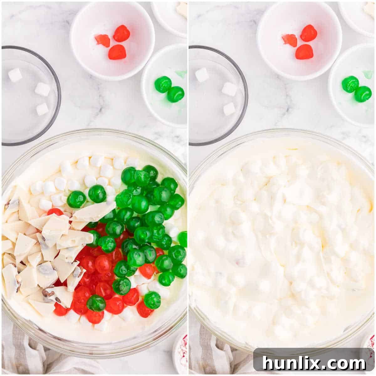 A close-up of Christmas Fluff in a mixing bowl, showing mini marshmallows, red and green glace cherries, and white chocolate almond bark mixed into the creamy base, ready for chilling.