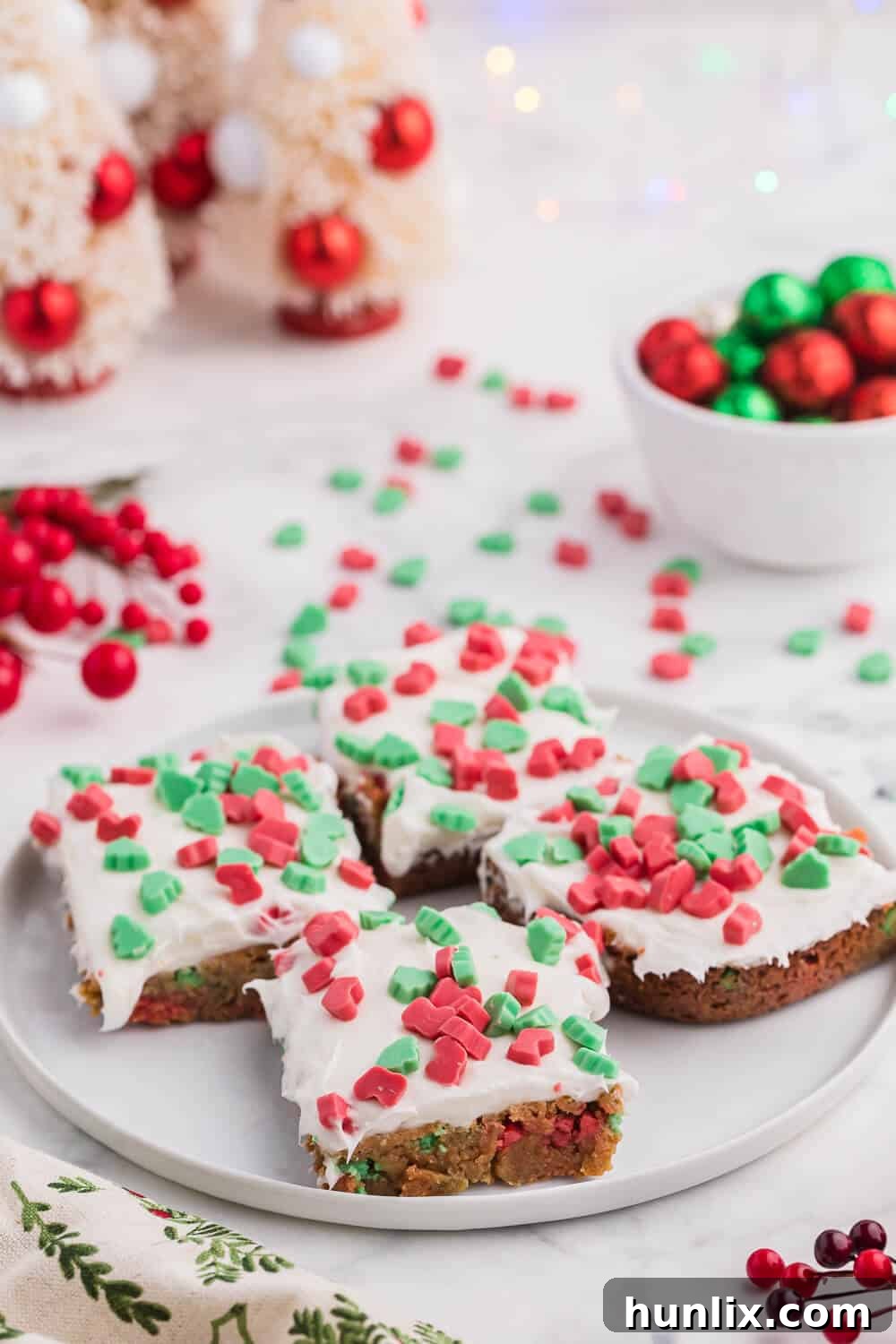 A beautifully presented Christmas Chewy Bar on a white plate, ready to be enjoyed.